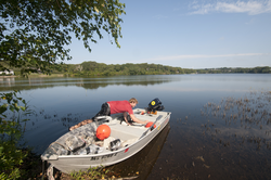 Peter van Hengstum preparing to launch skiff in Oyster Pond.