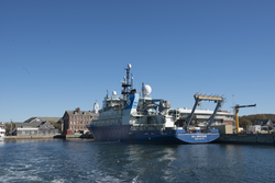 R/V Neil Armstrong tied up to the WHOI dock.