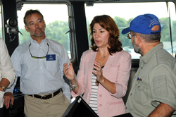 Peter Hill (left) and NSF associates touring R/V Sikuliaq's bridge.