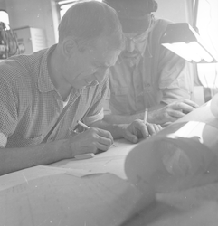 Dick Backus (L) and Bill Schevill working with charts