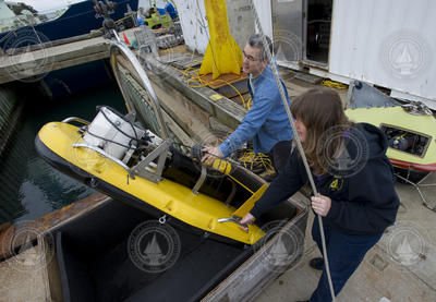 Tim Stanton and Cindy Sellers testing broadband sonar instrument at the dock.