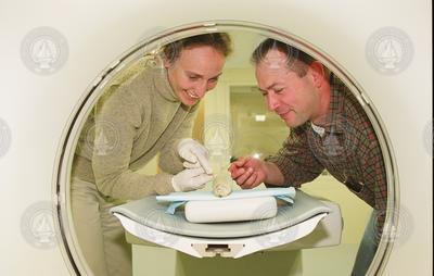 Andone Lavery and Mike Jech performing a CT scan on a fish.