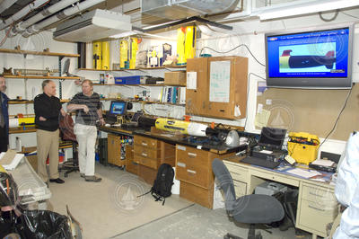 Frank Herr, RADM Nevin Carr, and Tom Austin in REMUS lab.