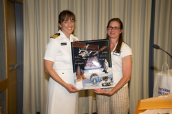 Becky Gast accepting commemorative gift for WHOI from Captain Stefanyshyn-Piper.