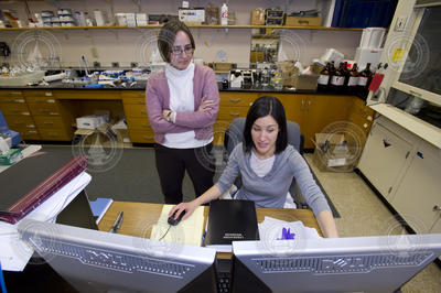 Elizabeth Kujawinski (glasses) and Melissa Soule with new mass spectrometer.