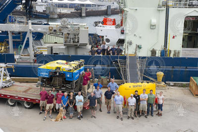 Family of NDSF vehicles and staff with R/V Atlantis at the WHOI dock.