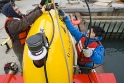 Sean Kelley and Justin Fujii preparing AUV Sentry for dock tests.