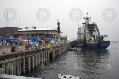 Science Stroll guests on WHOI's dock with R/V Atlantis.