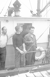 Dean Bumpus (L) fooling on deck of Anton Dohrn with two unidentified men
