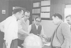 Group discussion over globe.