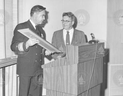 Allyn Vine (r) at podium receiving award.