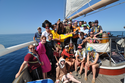 Jake Peirson Cruise participants dressed in costume on deck of the Cramer.