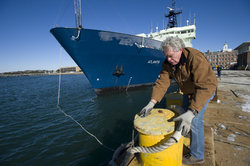 Rod Catanach handling the Atlantis dock lines as she returns from drydock.