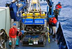 ROV Jason on deck being tended to by technicians.
