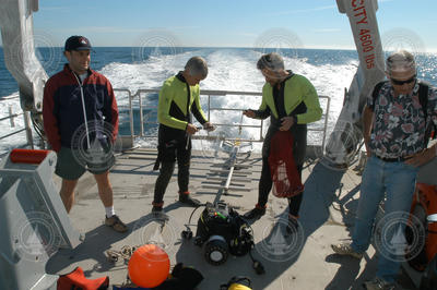2004 Ocean Science Journalism Fellows with divers aboard Tioga.