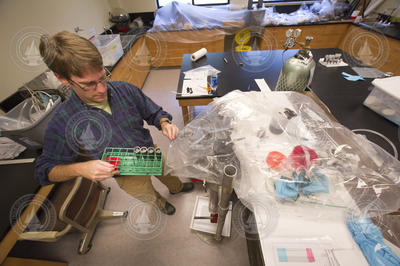 Carl Lamborg processing sediment cores from Boston harbor.