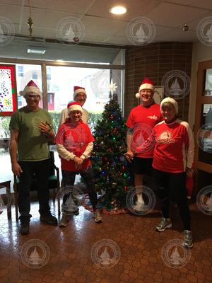 The Jingle Bell Joggers in Smith Lobby just prior to their annual trek.