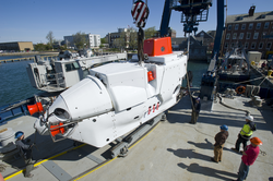 HOV Alvin being moved into position on its track on Atlantis fantail deck.