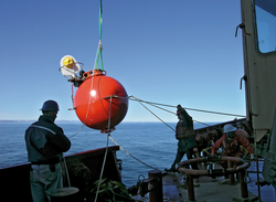 A flotation sphere fitted with an Arctic winch is deployed into Hudson Strait.