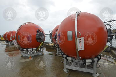 Pioneer Array mooring subsurface flotation spheres staged on the dock.