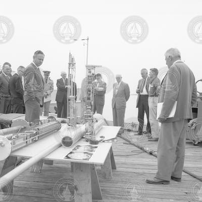 Group on WHOI dock looking at buoy.