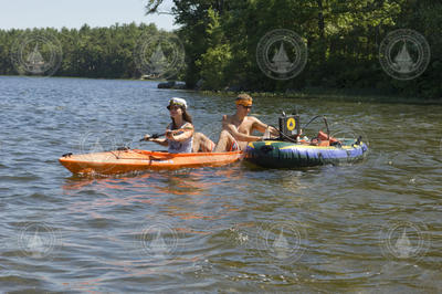 Peter Klos Zion and Nichole Trenohlm working in the field from a kayak.