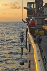 Patrick Hennessy and Benjamin Walther deploying a mooring.