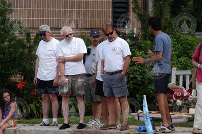 Spectators discuss strategy before the race.