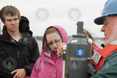 Bruce Tripp teaching students about Niskin bottle water sampling.