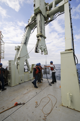 Scientists and crew deploying sediment traps off R/V Knorr.