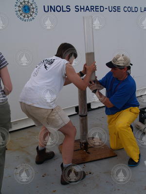 Ellen Roosen and Dan McCorkle carefully recovering a core sample on deck.