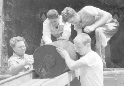 Joe Worzel and others unloading depth charges