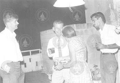 Dick Chase, Bill Von Arx, and Betty Bunce at party in San Juan