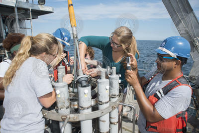 Summer Student Fellows preparing a CTD rosette for deployment.