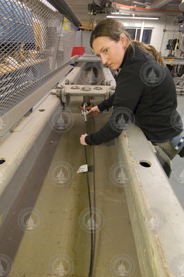 Dara Tebo testing a cable in the Mooring Lab.