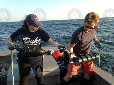 Aimee Boucher and Nicholas McFarlane preparing a mooring for deployment.