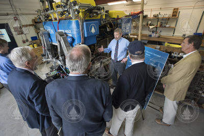 Matt Heintz talking with board-corp.meeting participants about ROV Jason.