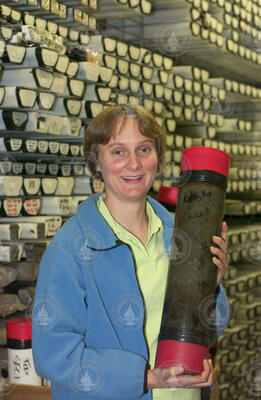 Linda Kalnejais in core lab holding a core.
