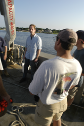 Tioga Captain Ken Houtler addressing the science party