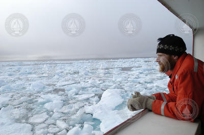 Jeremy Kaspar watching icy ocean from USCGC Healy.
