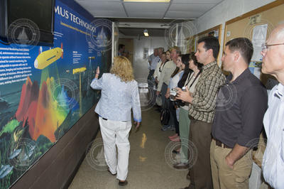 Kathy Patterson leading state officials and OPET members on a WHOI tour.