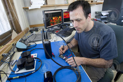 Engineer Fred Jaffre working on elephant seal sonar tag.