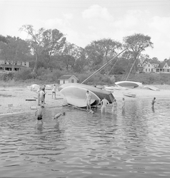 Boats on beach in Vineyard Haven after Hurricane Carol.