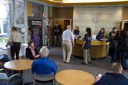 Colloquium attendees arriving in Redfield Lobby.