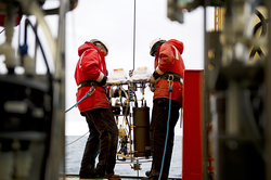 Dan Ohnemus (right) and another researcher deploying a water pump.