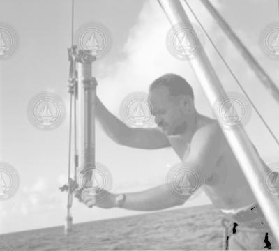 Martin Pollak with instrument aboard unidentified ship