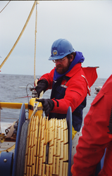 Frank Bahr winding SeaSoar tow cable onto a winch.