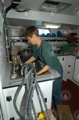 Heidi Sosik works on the power supply for the flow cytometer.