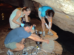 Matt Charette, Meagan Gonneea, and Crystal Breier sampling in a cave.
