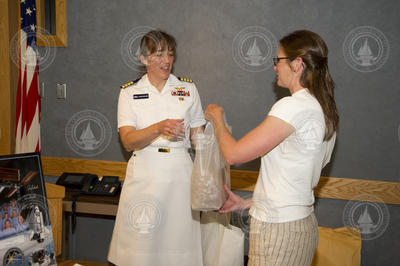 Becky Gast presenting appreciation gift to Captain Stefanyshyn-Piper.